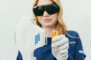 A Dermatology Aesthetics of Northern Kentucky provider removes the cover of the BBL Hero before an appointment for intense pulsed light in Florence.