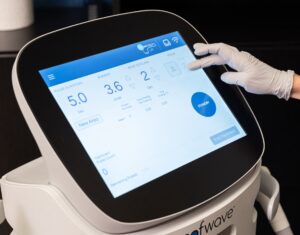 A Dermatology Aesthetics of Northern Kentucky provider adjusts the intensity of our Sofwave device for non surgical skin tightening near Cincinnati.